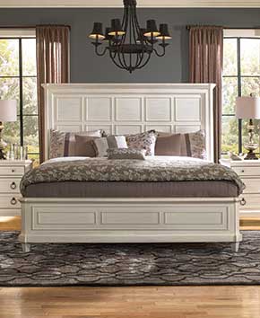 white bedframe with matching dressers